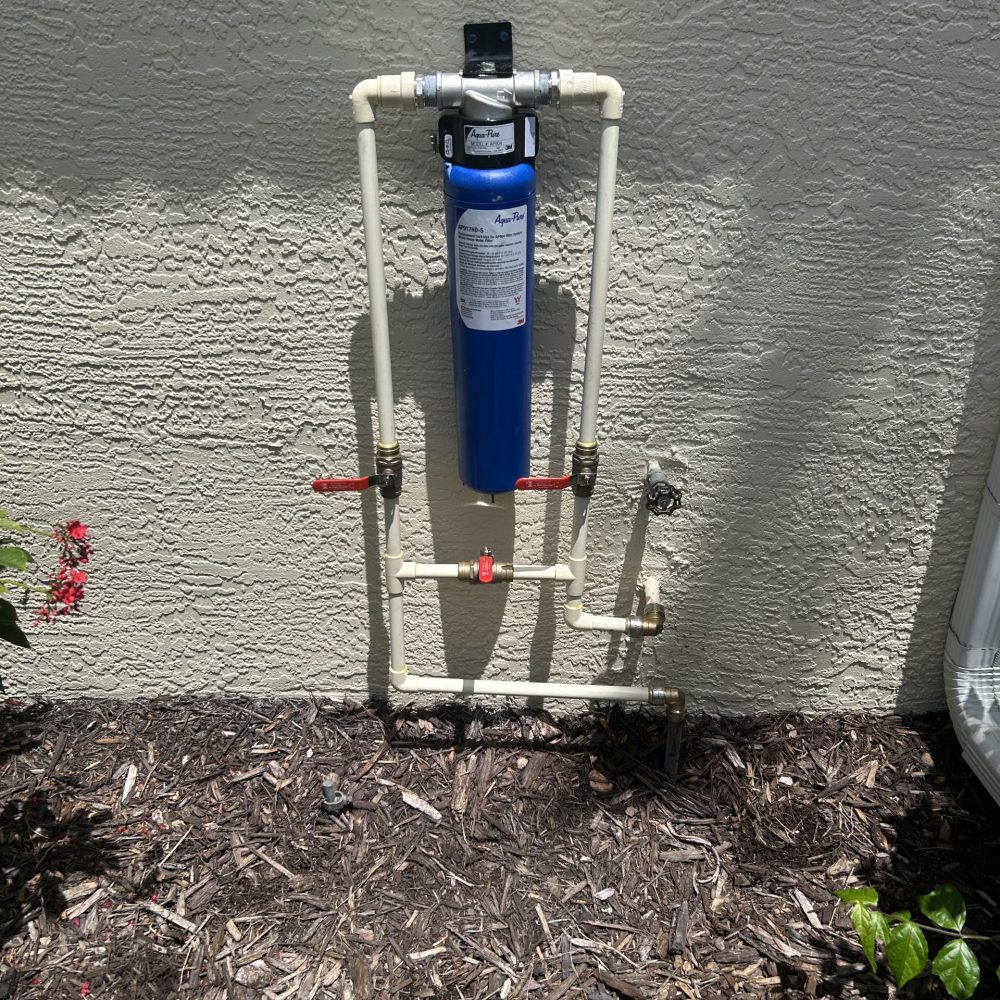 Residential water filtration equipment installed as part of a home plumbing system.